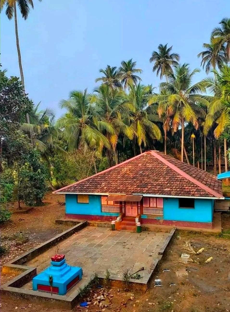 Tiled Kokan Homestead surrounded by the landscape and homes of rural Kokan